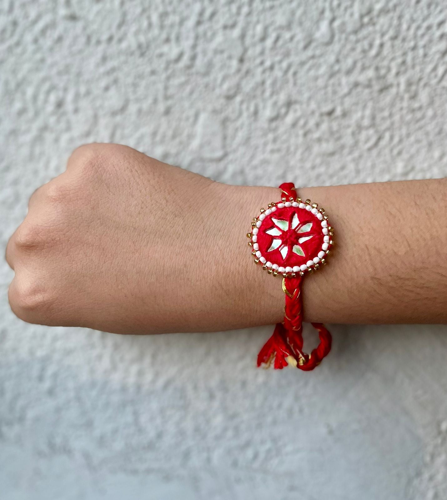 Red mirror work rakhi  (set of 2) with rice & tilak